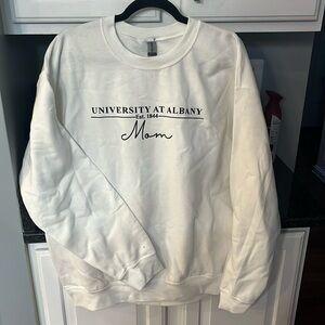 White large Gildan sweatshirt. “UAlbany Mom”. New, never worn, no tags.